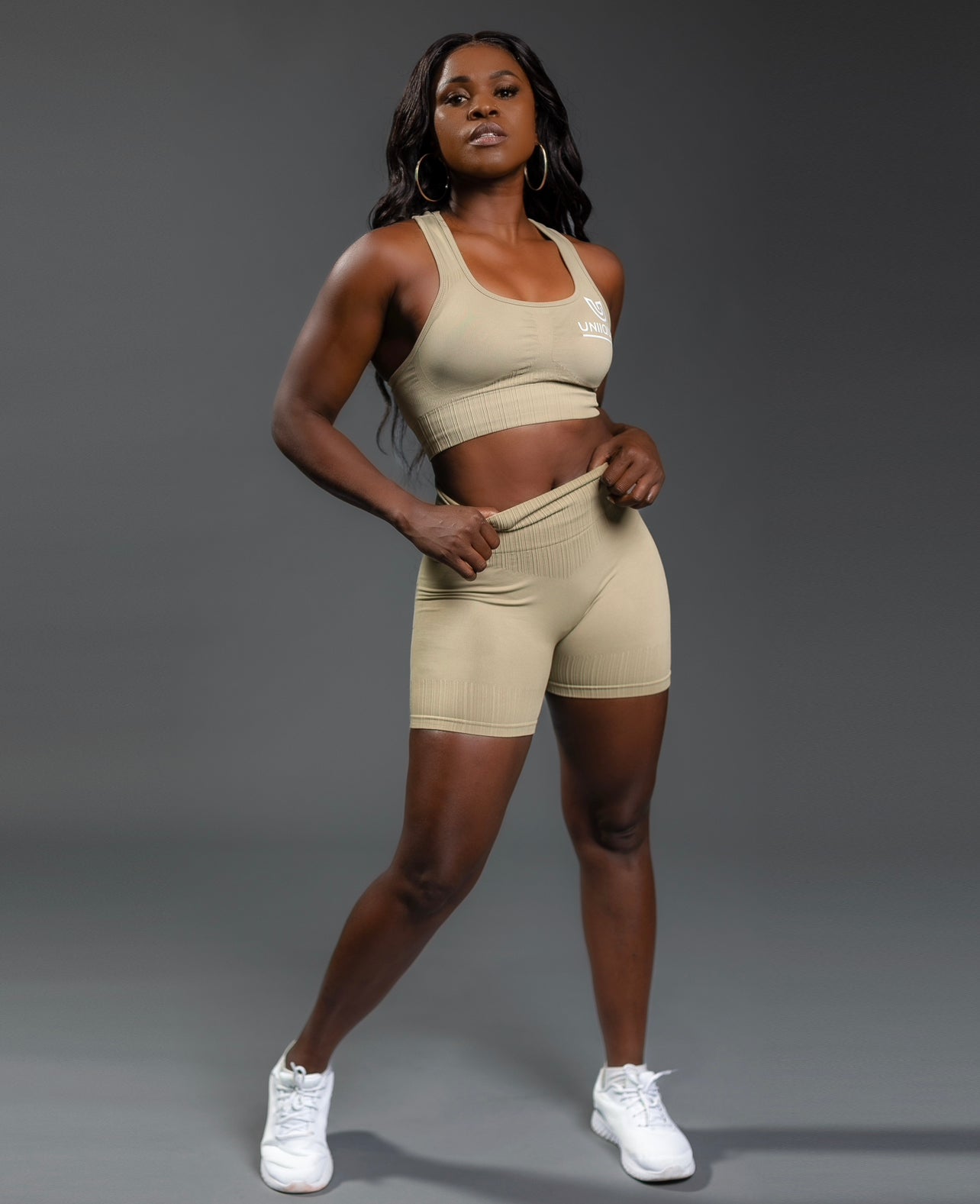 Tan seamless workout shorts set with high-waisted butt lifting shorts and supportive sports bra, designed for a sculpted fit, waist slimming