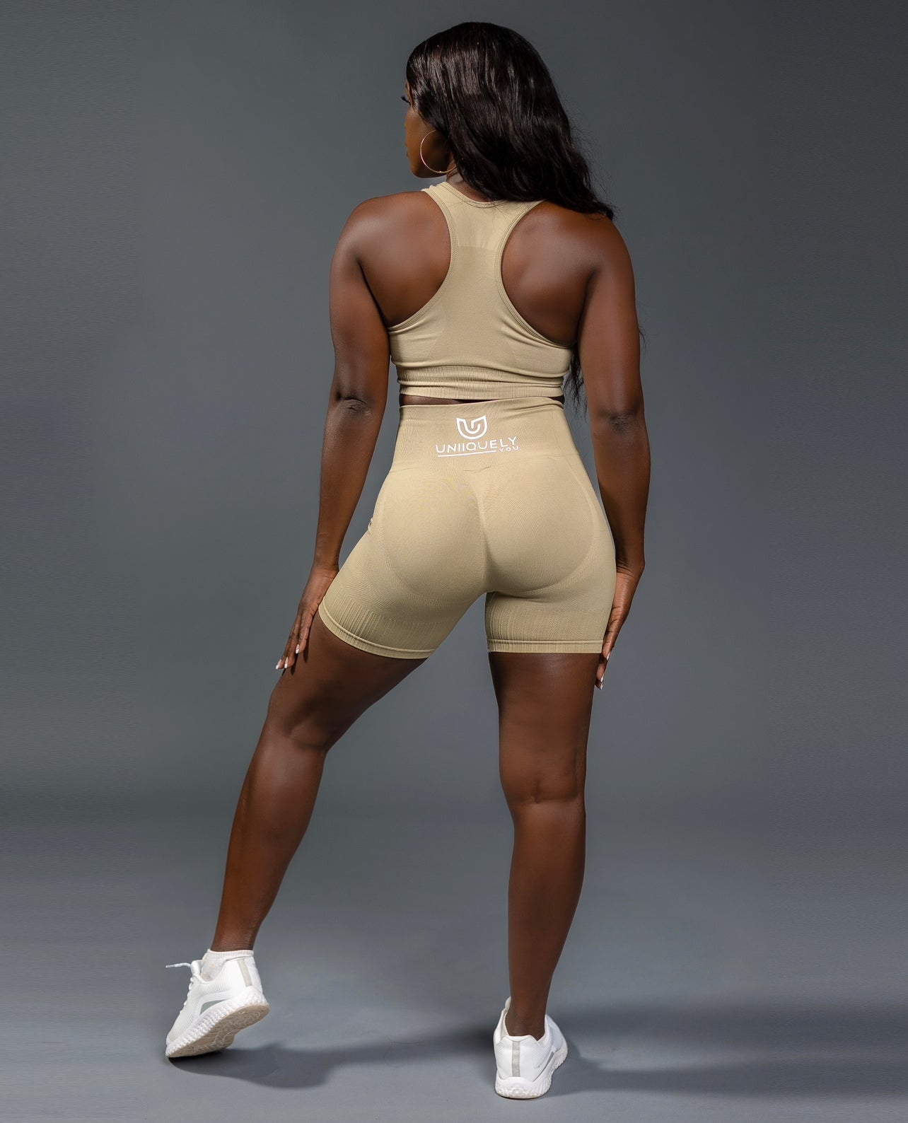 Tan seamless workout shorts set with high-waisted butt lifting shorts and supportive sports bra, designed for a sculpted fit, waist slimming