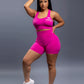 Pink seamless workout shorts set with high-waisted butt lifting shorts and supportive sports bra, designed for a sculpted fit, waist slimming, and smooth