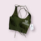 Green rippled cross-back sports bra with seamless design, supportive fit, breathable fabric, and stylish strappy back detail for workouts and activewear