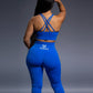 Royal blue seamless workout set with cross-back strappy sports bra and high-waisted leggings featuring butt lift design, waist-slimming fit, and smooth sculpting fabric