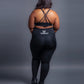 Black seamless workout set with cross-back strappy sports bra and high-waisted leggings featuring butt lifting design, waist-slimming fit, and smooth sculpting