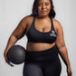 Black seamless workout set with cross-back strappy sports bra and high-waisted leggings featuring butt lifting design, waist-slimming fit, and smooth sculpting fabric