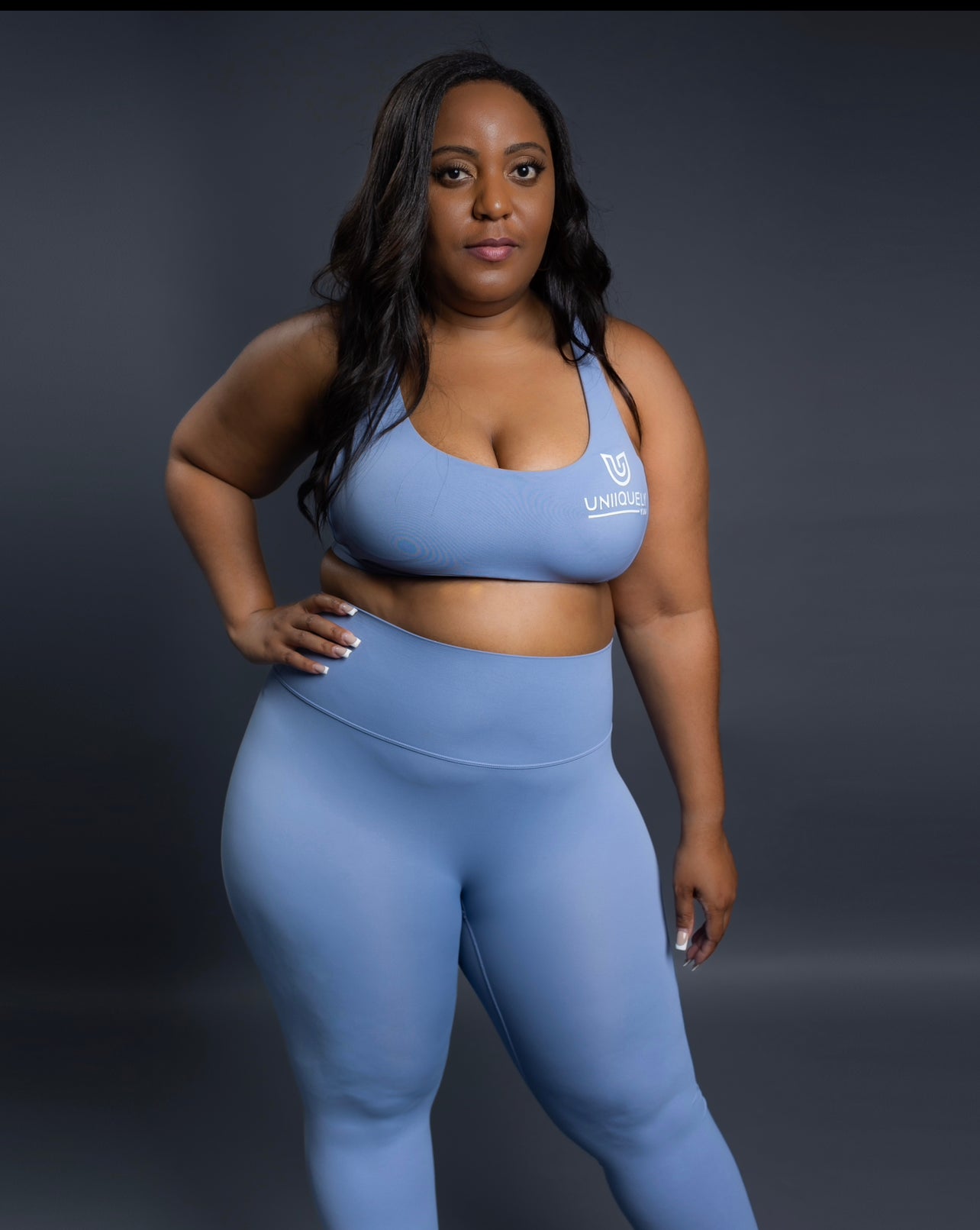 Light blue seamless workout set with cross-back sports bra and high-waisted leggings featuring butt lift design, waist-slimming fit, and smooth sculpting fabric