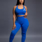 Royal blue seamless workout set with cross-back strappy sports bra and high-waisted leggings featuring butt lift design, waist-slimming fit, and smooth sculpting fabric