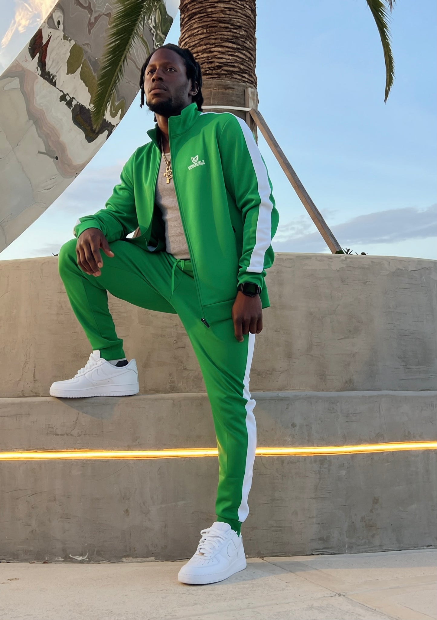Men’s green tracksuit with white side stripes, athletic fit two-piece set with zip jacket and matching pants