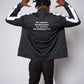 Men’s black slim-fit performance tracksuit with white side stripe detailing, featuring a zip-up jacket and tapered joggers, styled with white sneakers for a clean, athletic streetwear look built for comfort, confidence, and everyday performance.